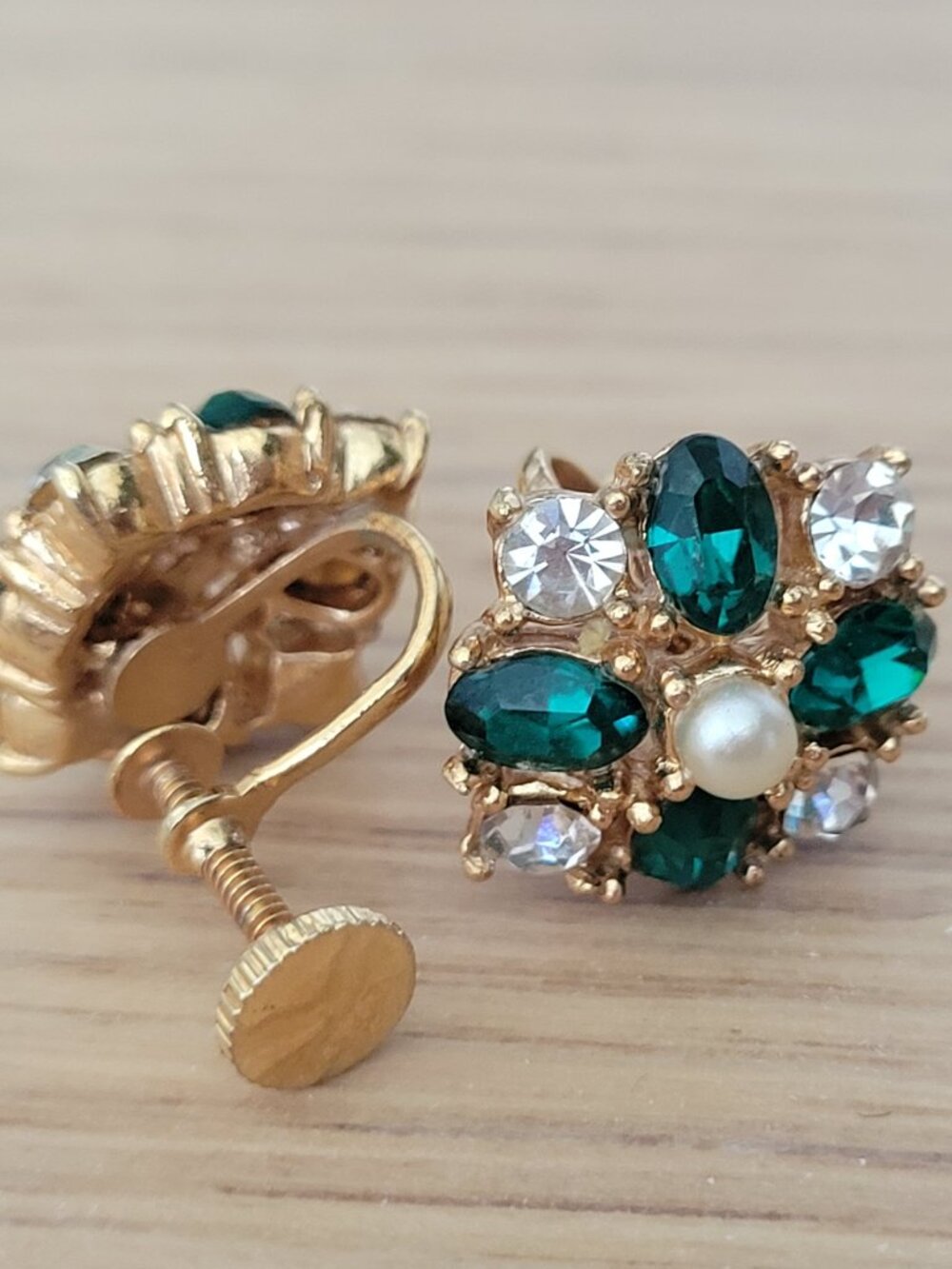 Vintage gold-tone floral cluster screw-back earrings feature a central faux pear
